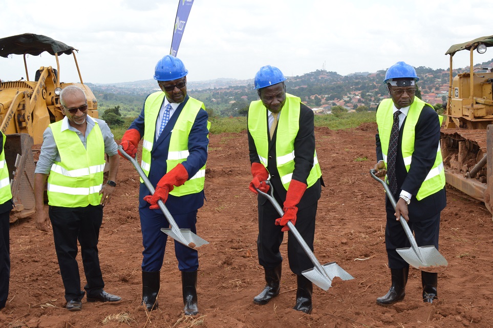 Right-left: NSSF Board Chairman, Patrick Kaberenge, Hon. Matia Kasaija, and NSSF Managing Director Richard Byarugaba breaking the ground for the construction of Lubowa Housing Project as one of the contractors looks on.