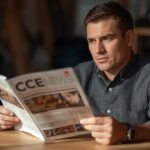 a person opening construction magazine CCE NEWS